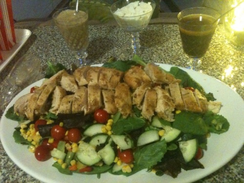 Light salad of cucumber, corn, cherry tomatoes, carrots, and mustard/herb marinated chicken. 